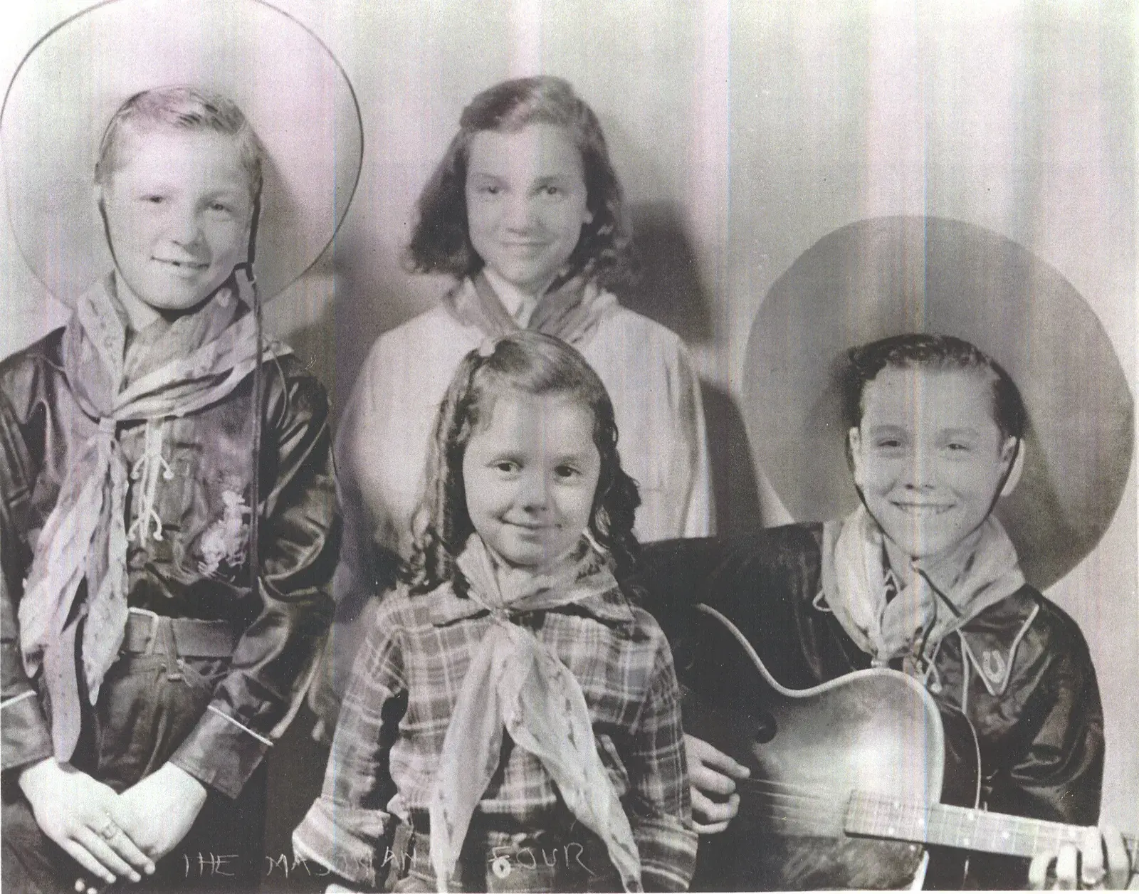 The Mastrianni Quartet — four young Plainville children dressed as cowboys with instruments